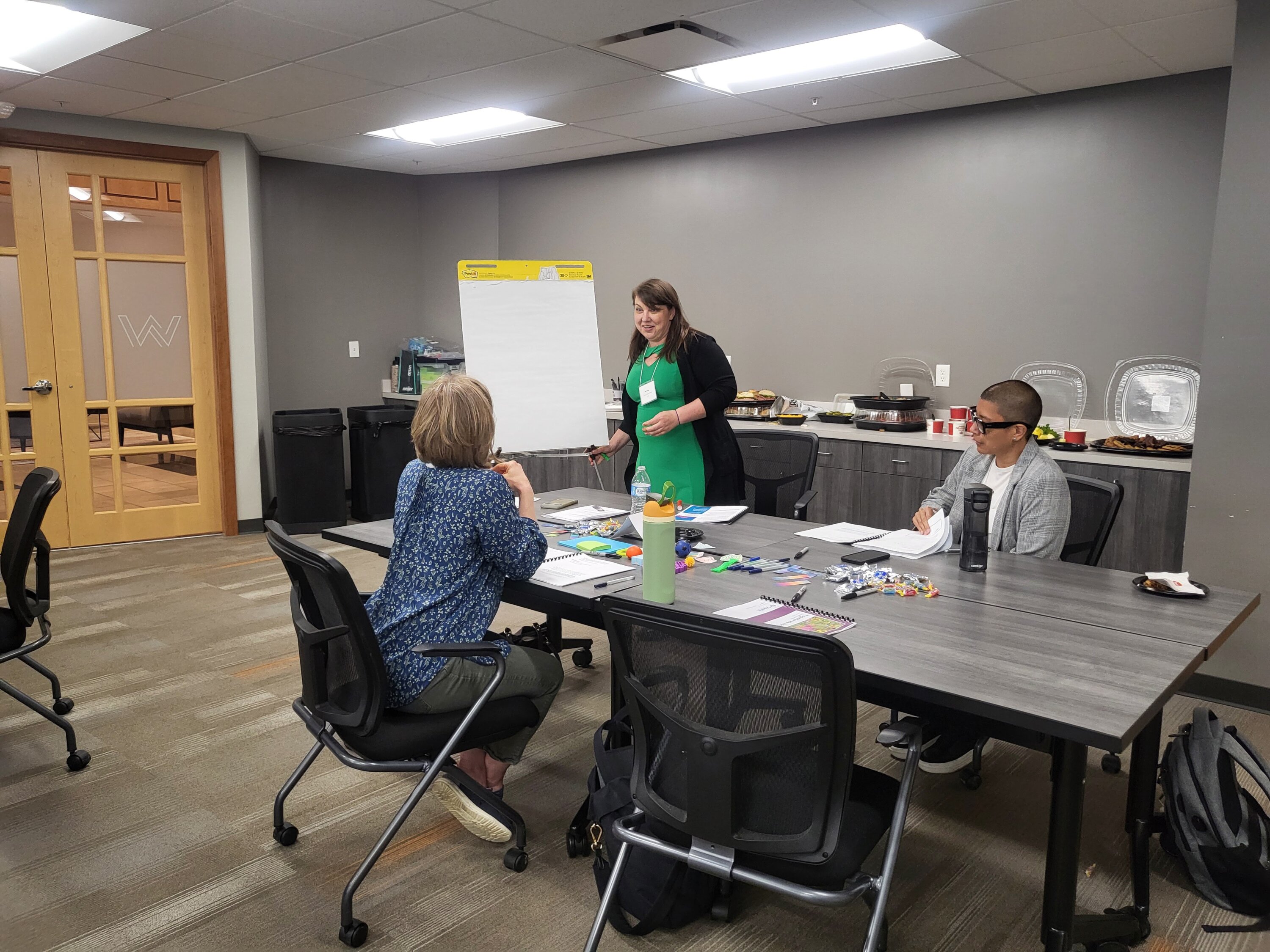 Elizabeth Lang (pictured standing), Digital Librarian at Cincinnati Children’s Hospital, facilitates discussion during the Together We Thrive: Dream Summit.