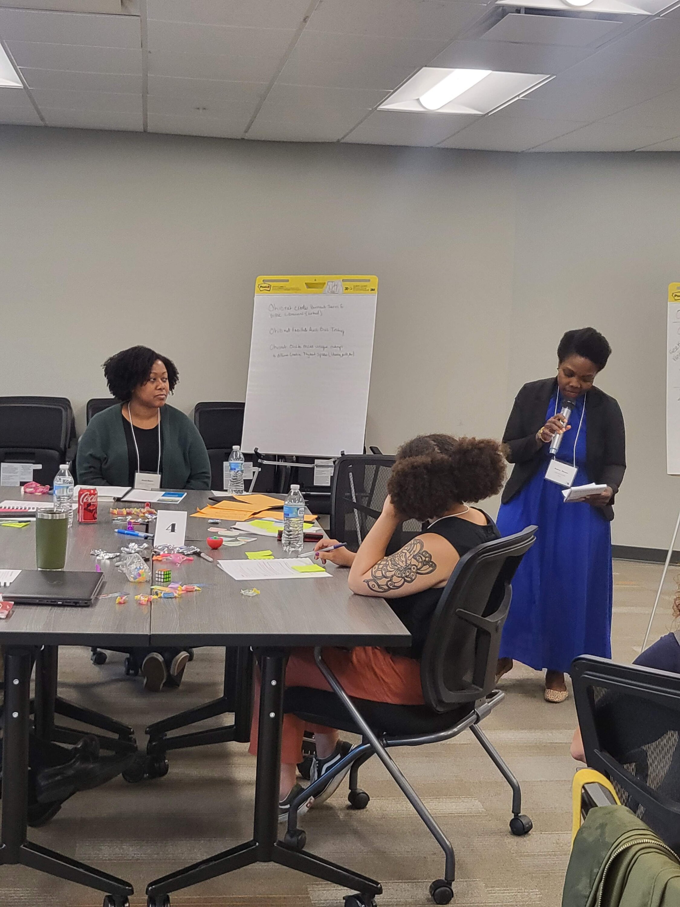 Desiree Thomas (pictured standing), Youth Services Librarian at Worthington Libraries, facilitates discussion and shares ideas for creating inclusion in Ohio libraries.